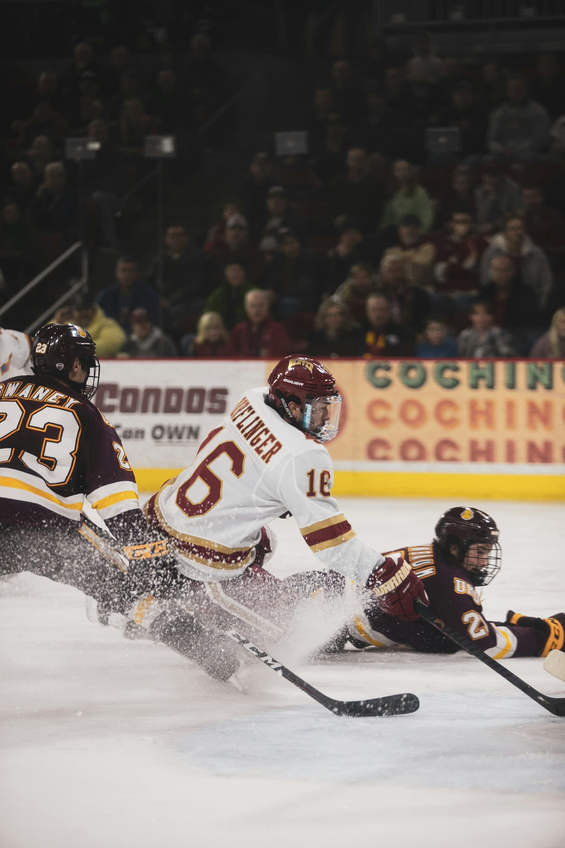 Ice hockey players competing for the puck